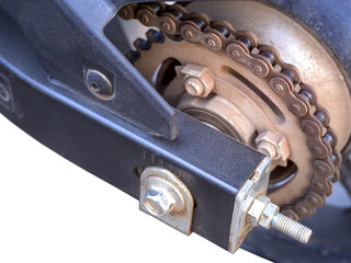 Old dirty motorcycle chain isolated on white background. Close up of rusty chain on the wheel with rusty metal parts. Copy space.