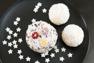 Homemade coconut candy balls on a plate