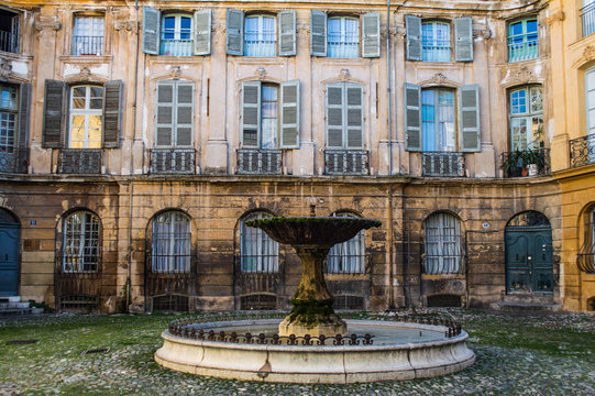 Romantic Fountain with Beautiful Old House in the Back at Place D'Albertas in Aix-en-Provence, France