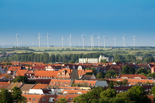 Wind green energy generators over city