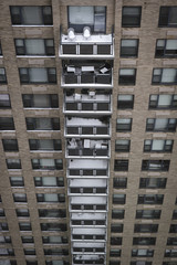 Column of snow covered balconies on Manhattan high-rise after snowstorm Stella - 140853784