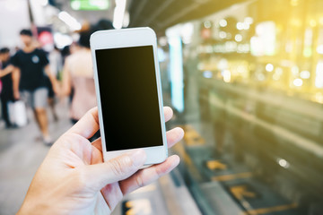 Smartphone black screen in hand at train station