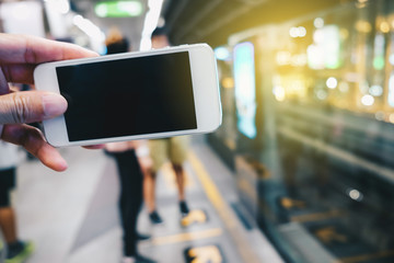 Smartphone black screen in hand at train station
