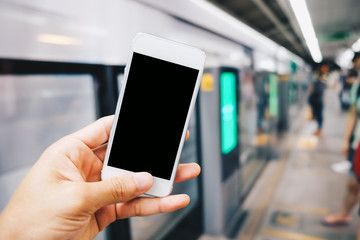 Smartphone black screen in hand at train station