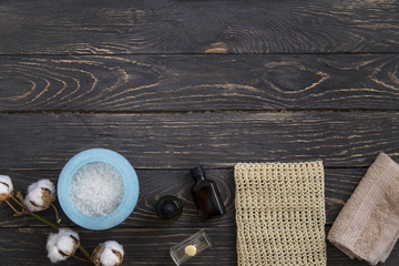 Spa beauty treatment products top view on wooden background. Copy space