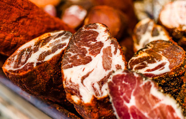 Selection of traditional Italian cured meats and sausages, selective focus