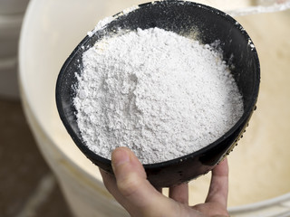 Dental technician is working with gypsum to make a flask mold.