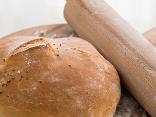 Round bun bread with a rolling pin
