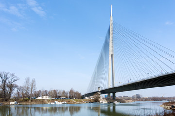 Small harbor and view to the Ada bridge on the river Sava in Belgrade, Serbia 