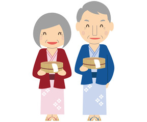 Fototapeta premium かわいい家族 シニアカップル 風呂桶を持って浴衣で温泉