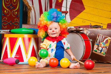 Little baby clown with red nose multi-colored wig in with balls