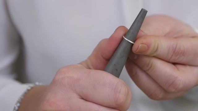 Jewelry master hands stretching and bending wire for jewellery