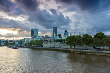 Fototapeta na wymiar LONDON, ENGLAND - JUNE 15 2016: Sunset Skyline of London From Tower Bridge, England, United Kingdom