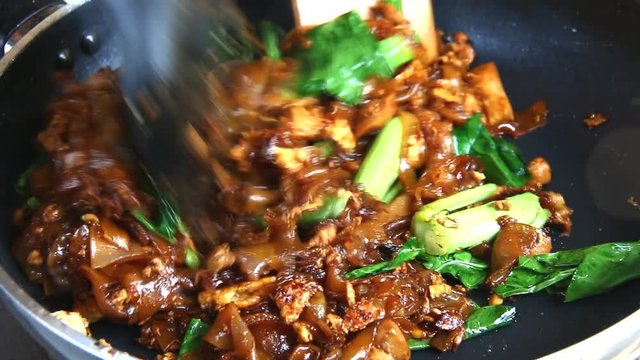 frying flat noodle and pork with preserved soy bean paste