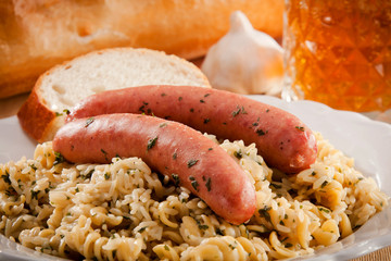Bratwurst on Pasta and Rice Dinner Plate