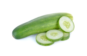 whole and sliced fresh cucumber on white background