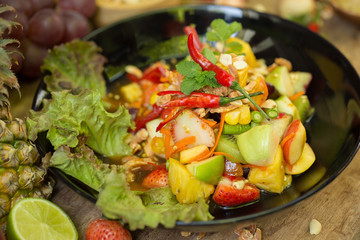 kitchen table with spicy papaya salad and ingredient food Thai national food concept of hot asian food