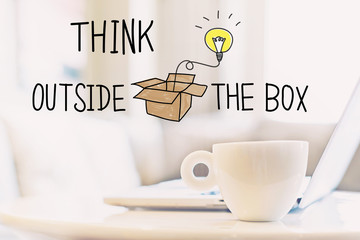 Think Outside The Box concept with a cup of coffee