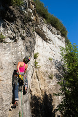 Woman rock climbing on Ontario's Niagara Escarpment in Canada