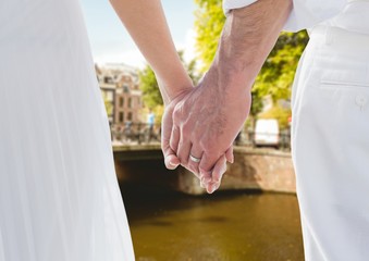 Married couple holding hands at vacation