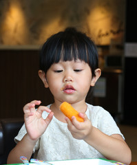 Adorable child girl eating Deep-fried Cheese Stick