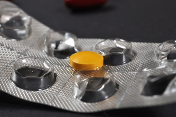 Last yellow pills, a pill taken out from table