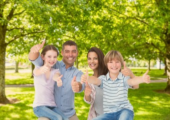 Fototapeta premium Family showing thumbs up in park