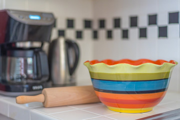 colorful bowl and coffee maker