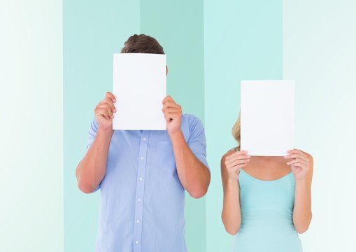 Couple Covering Their Face With Blank Paper