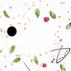 Floral frame. Red rose bud, glasses, leaves, coffee on white background. Entrepreneur or beauty blogger home office table desk workspace. Flat lay, top view