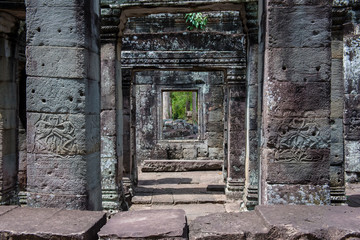 Pillars of the dance hall decorated with apsara - Siem Reap, Cambodia