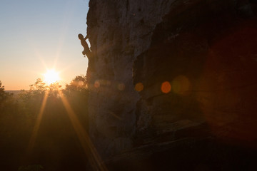 Silhouette of a Woman rock climbing on Ontario's Niagara Escarpment in Canada