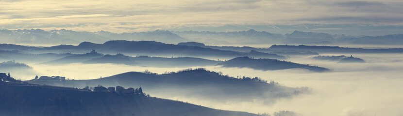 Panoramic view of Langhe hills in a foggy morning