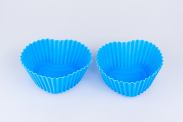 A color silicone cake form on a white background