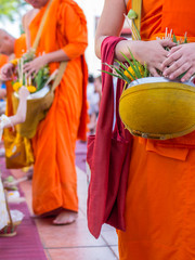 Offer sacrifice flowers to Buddhist monk