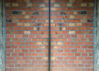 Brick wall of under construction background with surface level divide