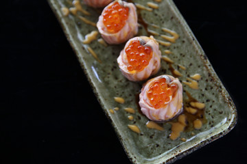 Salmon sushi ball with salmon caviar