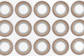 Pattern of concentric shapes made of rings and spirals on white background