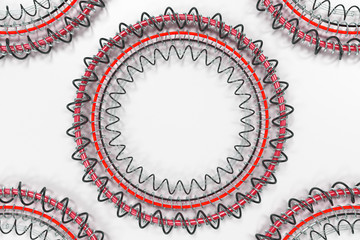 Pattern of concentric shapes made of rings and spirals on white background