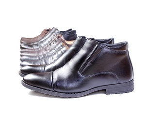 Men's shoes are put in a row