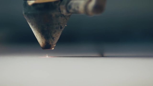 Laser cutting on wood closeup. Slow motion.