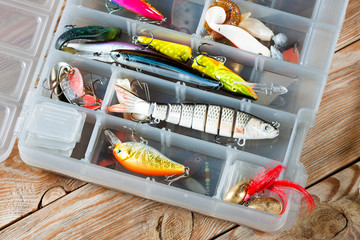 Fishing accessories on a wooden background. © Alex Ishchenko