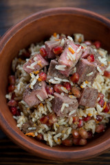 Close-up of pilaf cooked with beef meat in georgian style, view from above, shallow depth of field