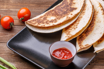 Quesadilla with chicken, tomatoes, dressing
