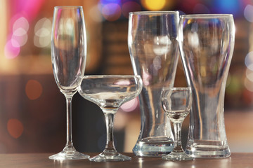 Different glassware on blurred background