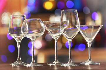 Different glassware on blurred background