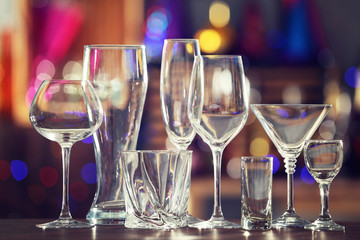 Different glassware on blurred background