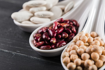 mix of beans on wooden table