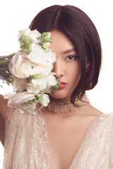 Bride. Asian female with wedding bouquet