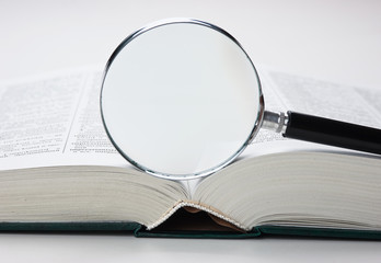  books and magnifying glass